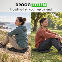 Man en vrouw zitten op het zitkussen buiten in de natuur